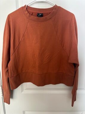 Nike Women's Rust Embossed Logo Cropped Crewneck Sweatshirt